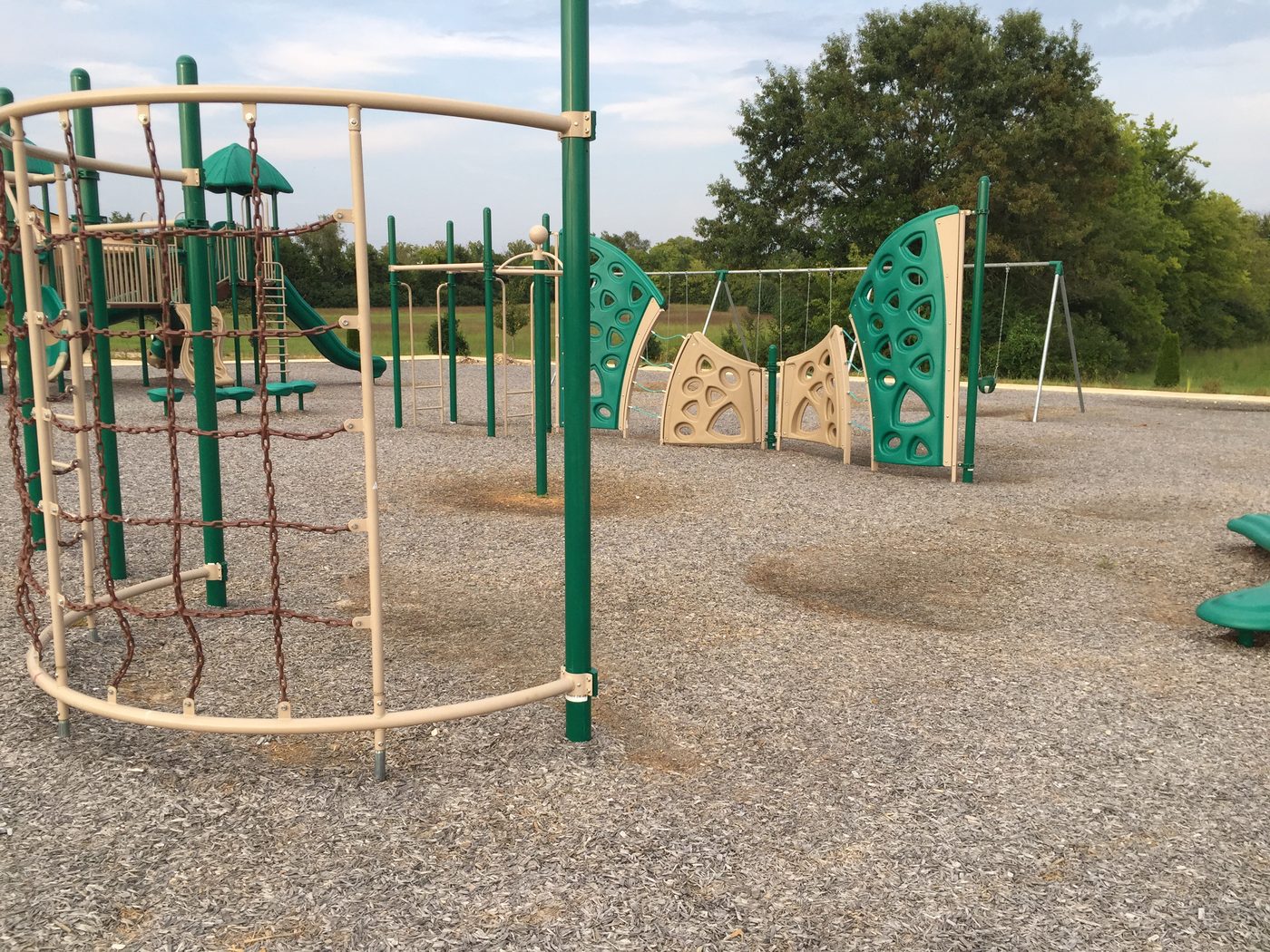 The playground built on ICM's campus in 2013, with climbing structures and swings